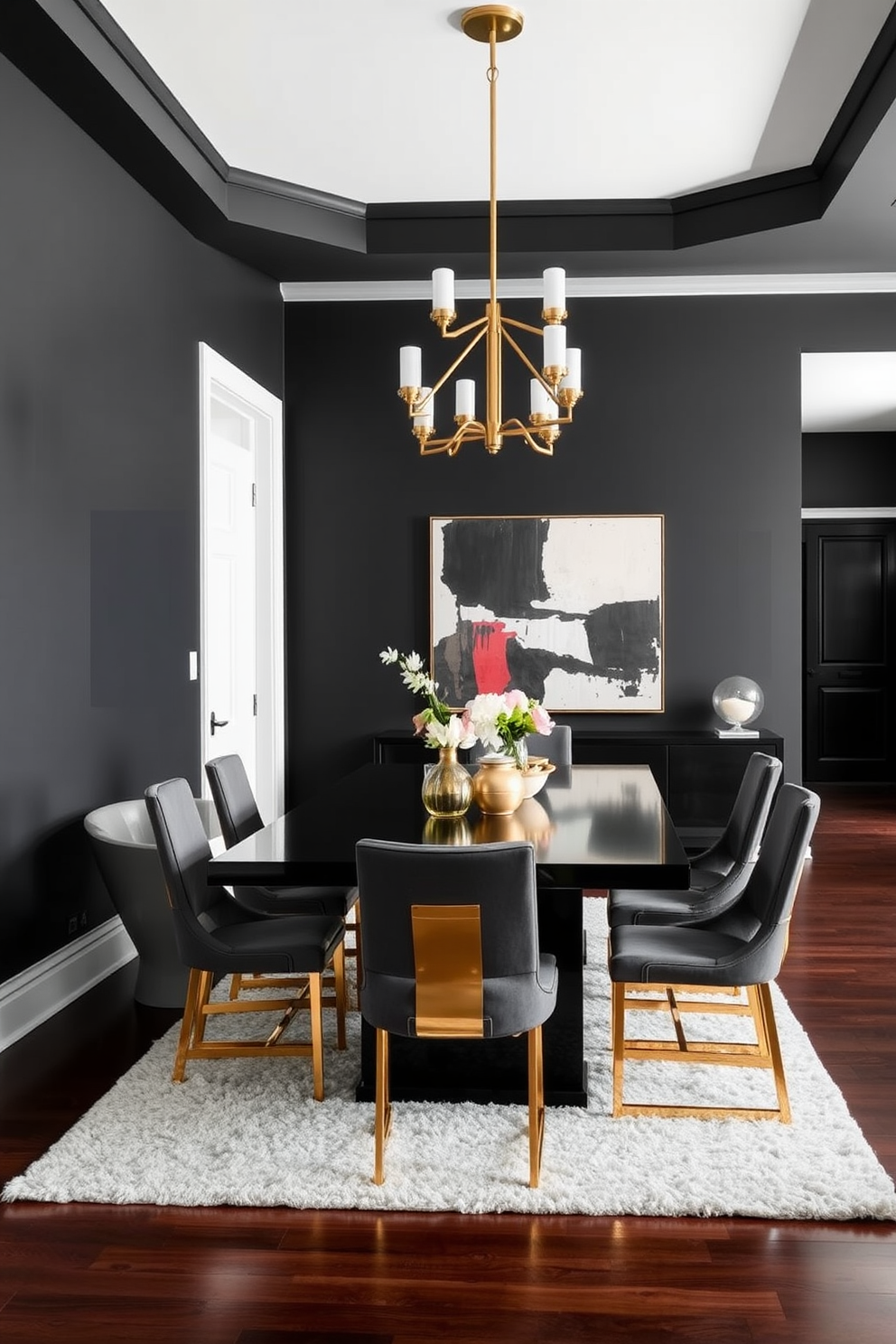 A striking black dining room features a sleek rectangular table surrounded by elegant brass-accented chairs. The walls are painted in a deep matte black, creating a dramatic backdrop for the gold and brass light fixtures hanging overhead. A stunning brass chandelier adds warmth and sophistication, while a large abstract artwork in contrasting colors adorns one wall. The floor is finished with dark hardwood, complemented by a plush area rug that brings texture and comfort to the space.