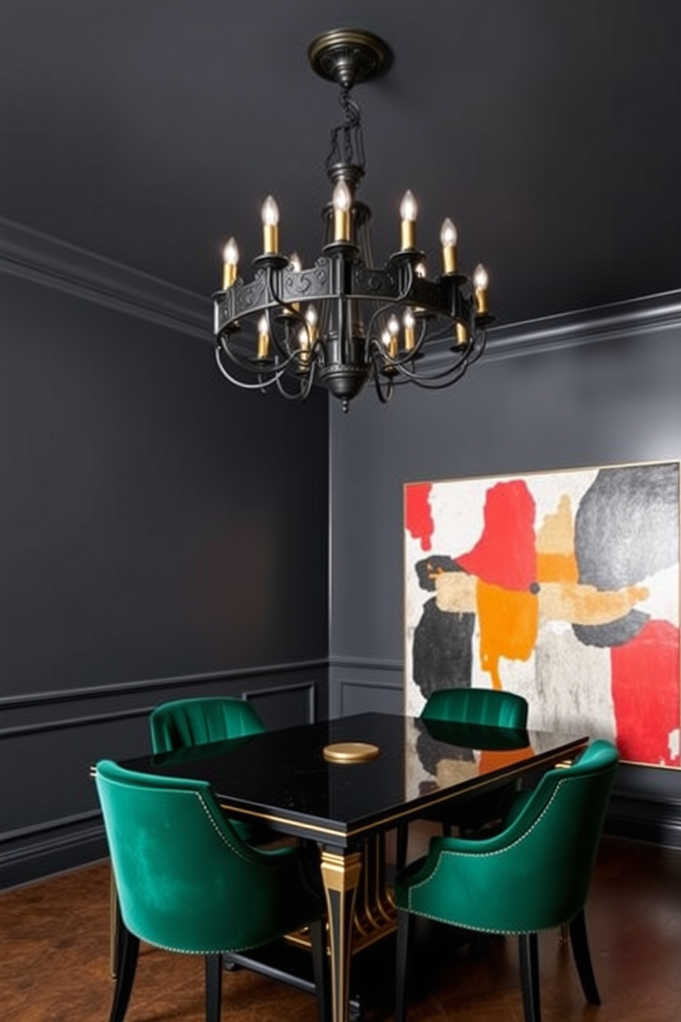 A striking black chandelier hangs from the ceiling, casting a dramatic glow over the dining area. The walls are painted in a deep charcoal hue, creating a moody and sophisticated atmosphere. The dining table is a sleek black wood with elegant gold accents, surrounded by plush velvet chairs in a rich emerald green. A large piece of abstract art in contrasting colors adorns the wall, adding a focal point to the space.