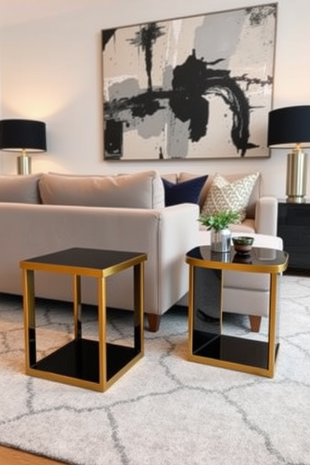 A modern family room featuring sleek black side tables with gold trim positioned beside a plush sectional sofa. The room is adorned with a large abstract painting on the wall, and a stylish area rug anchors the seating arrangement.