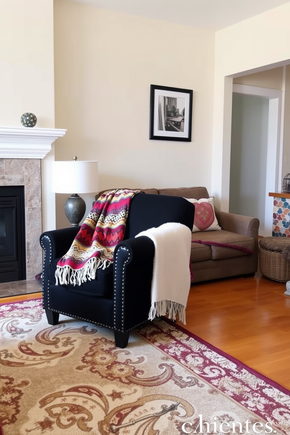 A cozy family room featuring a black accent chair adorned with a colorful throw draped over one arm. The walls are painted in a soft beige, and a large area rug anchors the seating area, adding warmth and texture to the space.