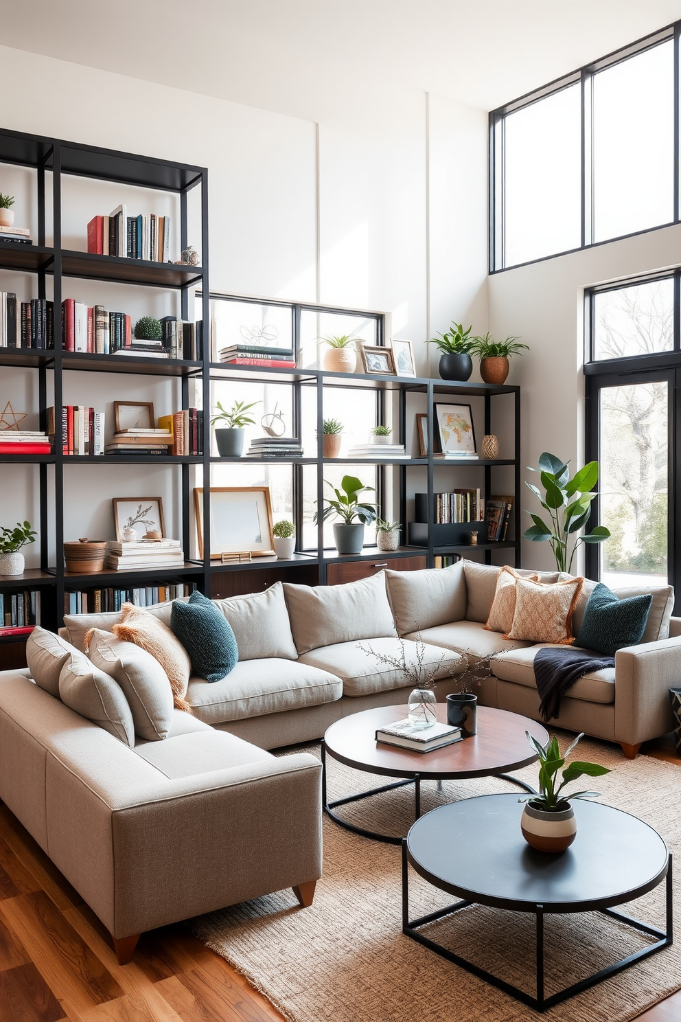 A contemporary family room featuring open shelving in a matte black finish. The shelves are filled with an assortment of books, decorative objects, and plants, creating a stylish yet functional display. The room is anchored by a plush sectional sofa in a neutral tone, complemented by textured throw pillows. Large windows allow natural light to flood the space, highlighting the warm wood accents and a cozy area rug beneath the coffee table.