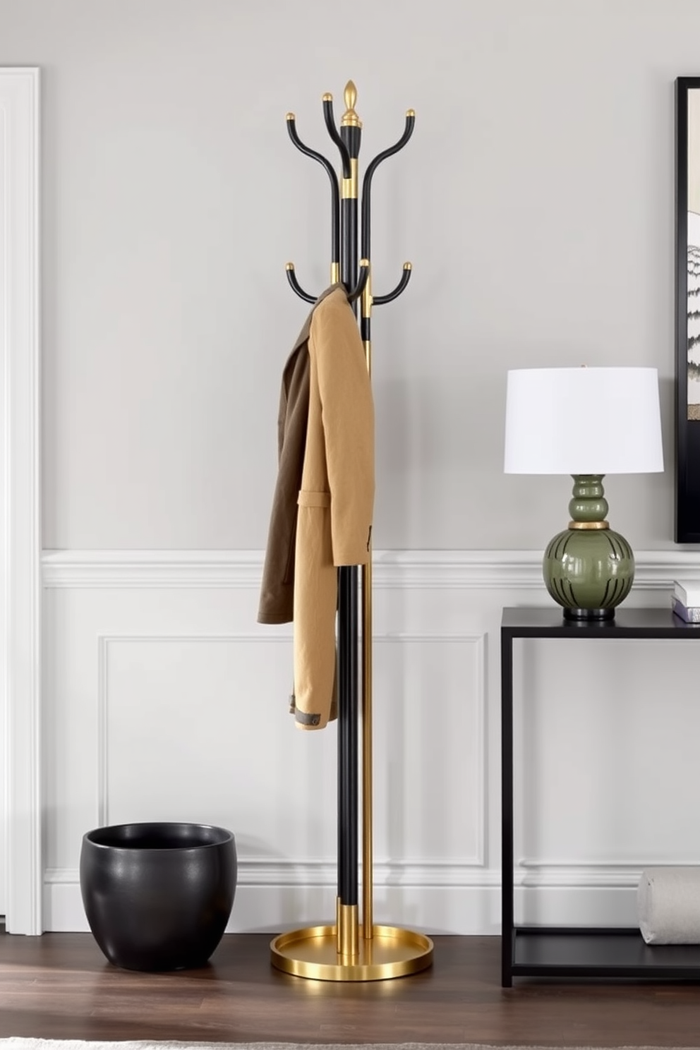 A contemporary black and brass coat rack stands elegantly in the foyer, serving as a stylish yet functional piece. The walls are adorned with a soft gray tone, while a sleek console table complements the coat rack, creating a cohesive and inviting entryway.