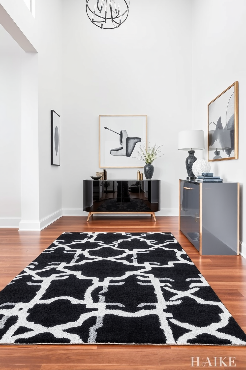 A chic black and white geometric rug lies elegantly on the polished hardwood floor of a modern foyer. The walls are adorned with minimalist artwork, and a sleek console table with a glossy finish stands against one side, topped with a stylish lamp and decorative objects.