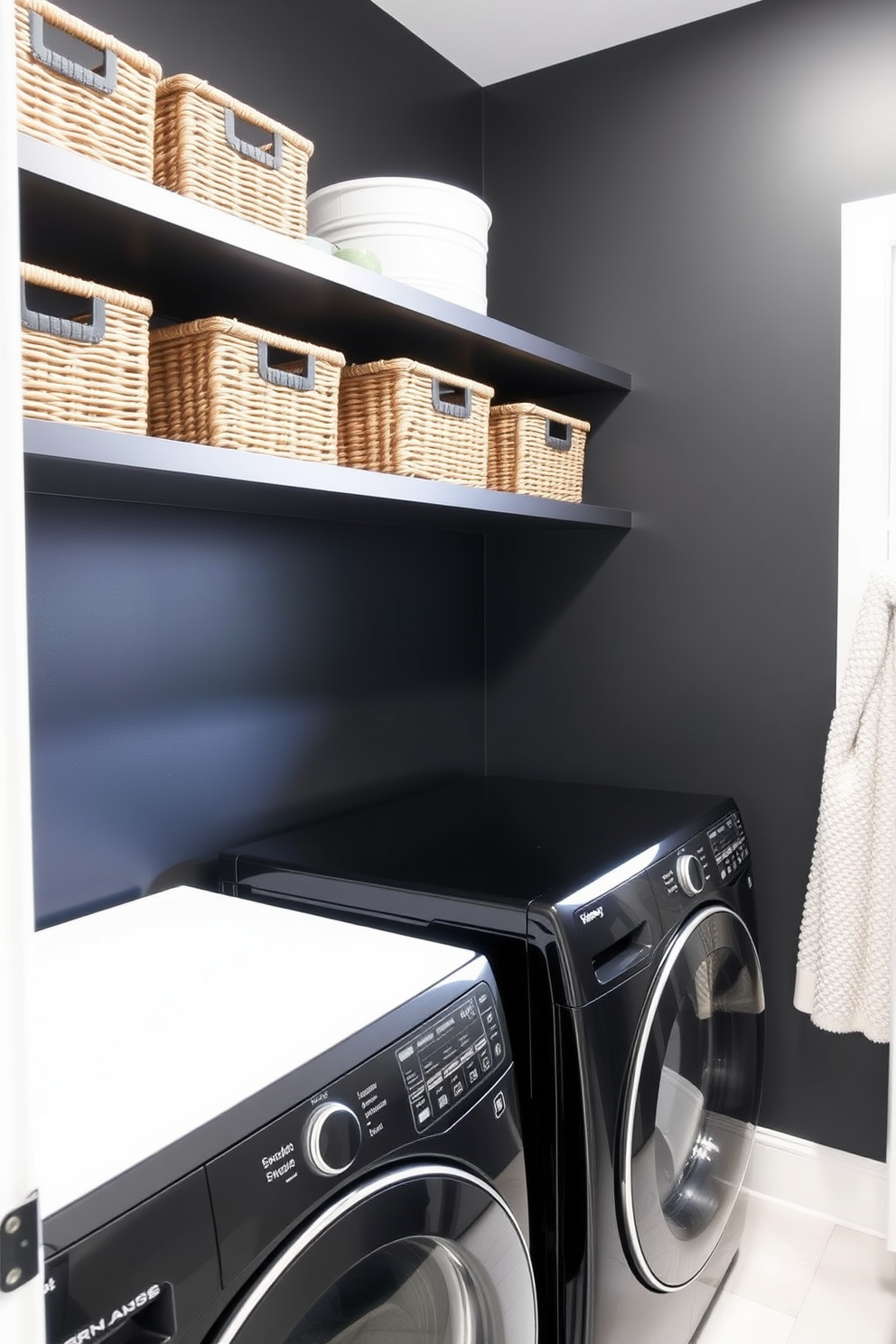 A sleek industrial laundry room features exposed metal pipes and fixtures, creating a raw and edgy atmosphere. The walls are painted in a deep charcoal gray, complemented by a black metal shelving unit filled with neatly organized laundry supplies. A large black washer and dryer set sits side by side, framed by a concrete countertop that offers ample folding space. Accents of warm wood are introduced through a rustic wooden bench, providing a stylish contrast to the overall dark theme.