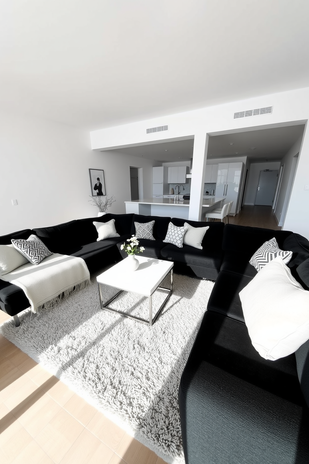 A stylish black living room featuring bold black artwork as the focal point on the main wall. The space is complemented by sleek furniture in varying shades of gray and white, creating a modern and inviting atmosphere.