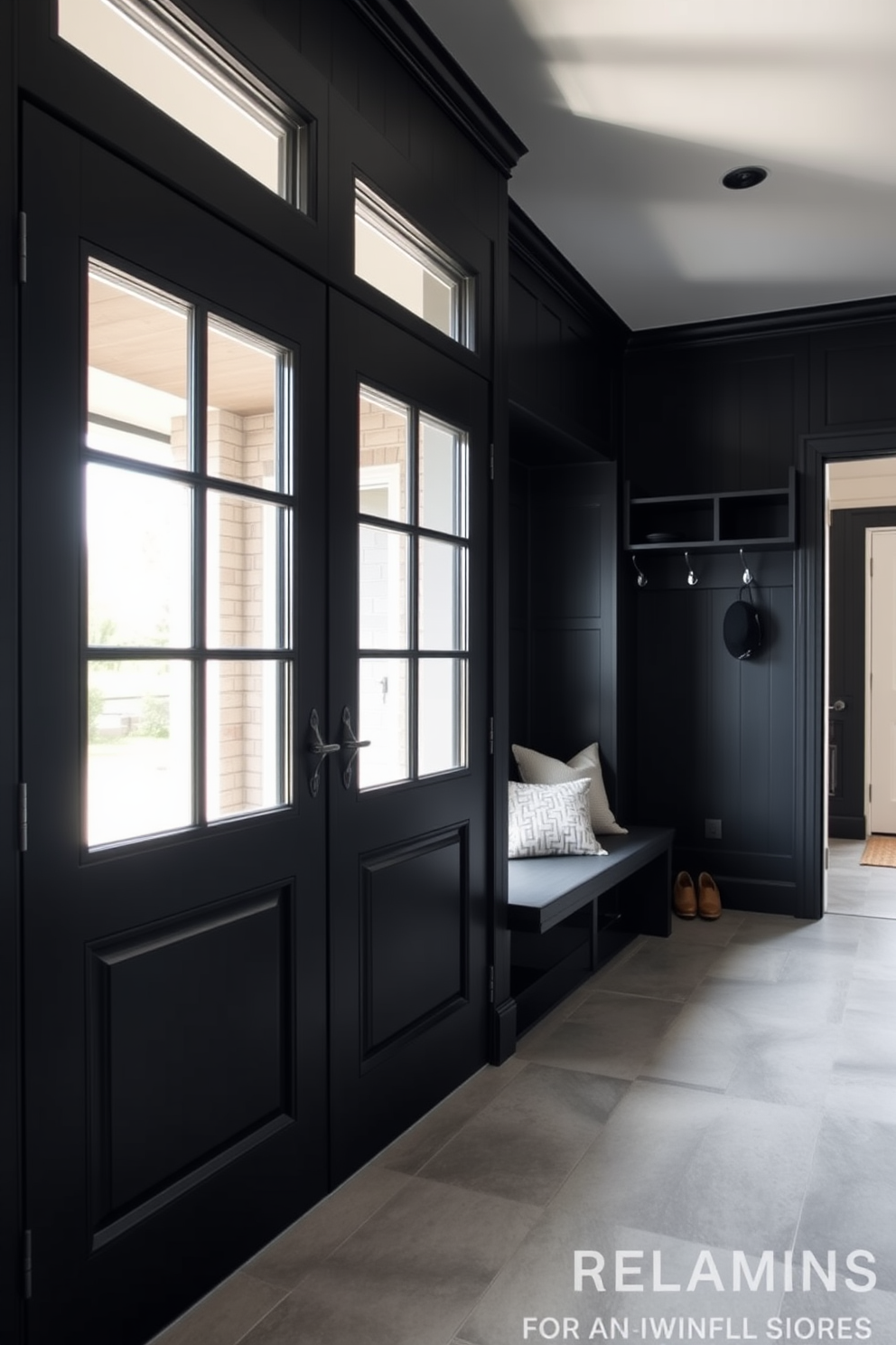 A rustic black wood bench is positioned against the wall, adorned with plush cushions in earthy tones. The mudroom features a combination of open shelving and hooks for storage, creating a functional yet inviting space.