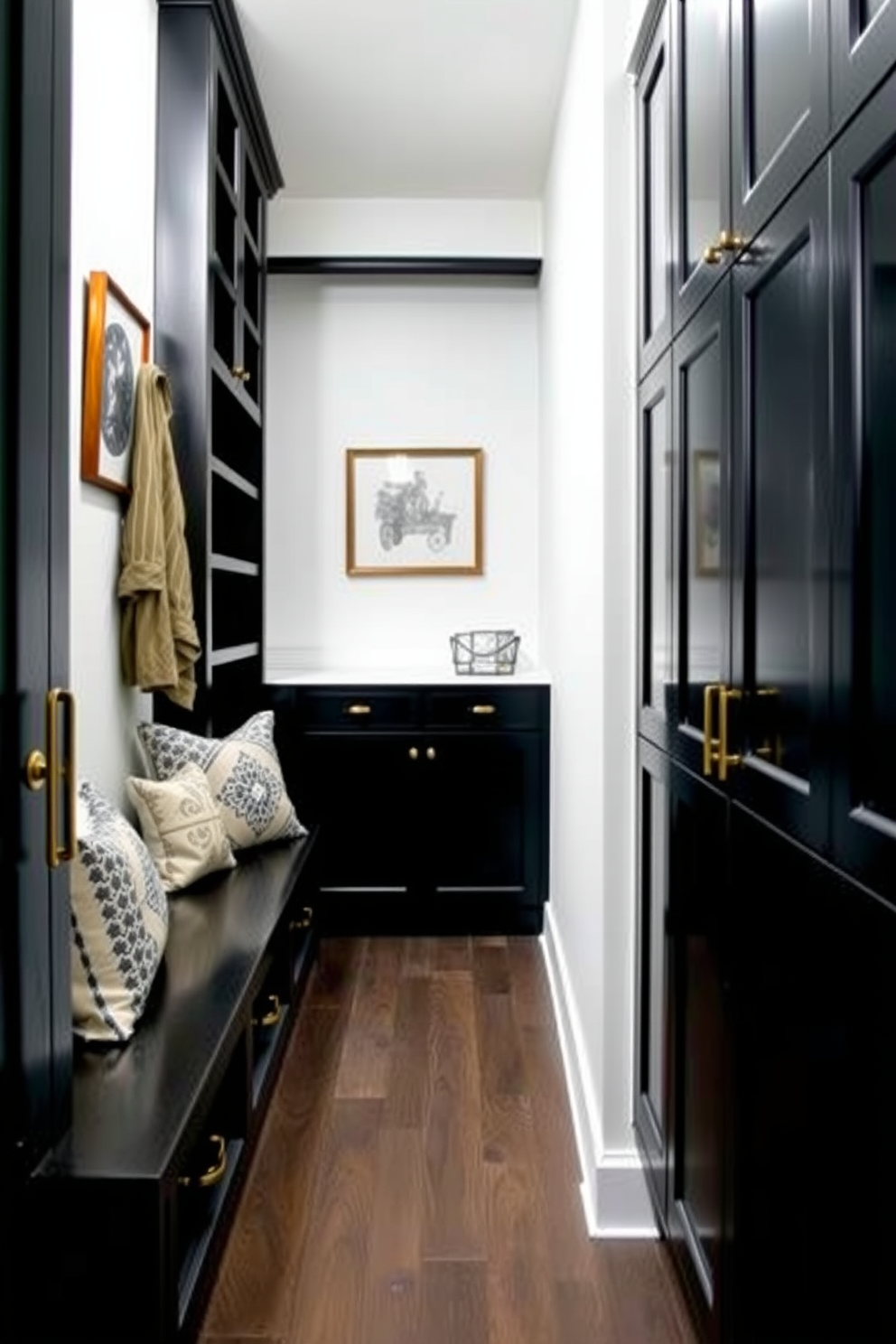 A sleek black cabinetry design features elegant brass hardware that adds a touch of sophistication. The mudroom is spacious and functional, with built-in storage solutions and a comfortable bench for convenience.