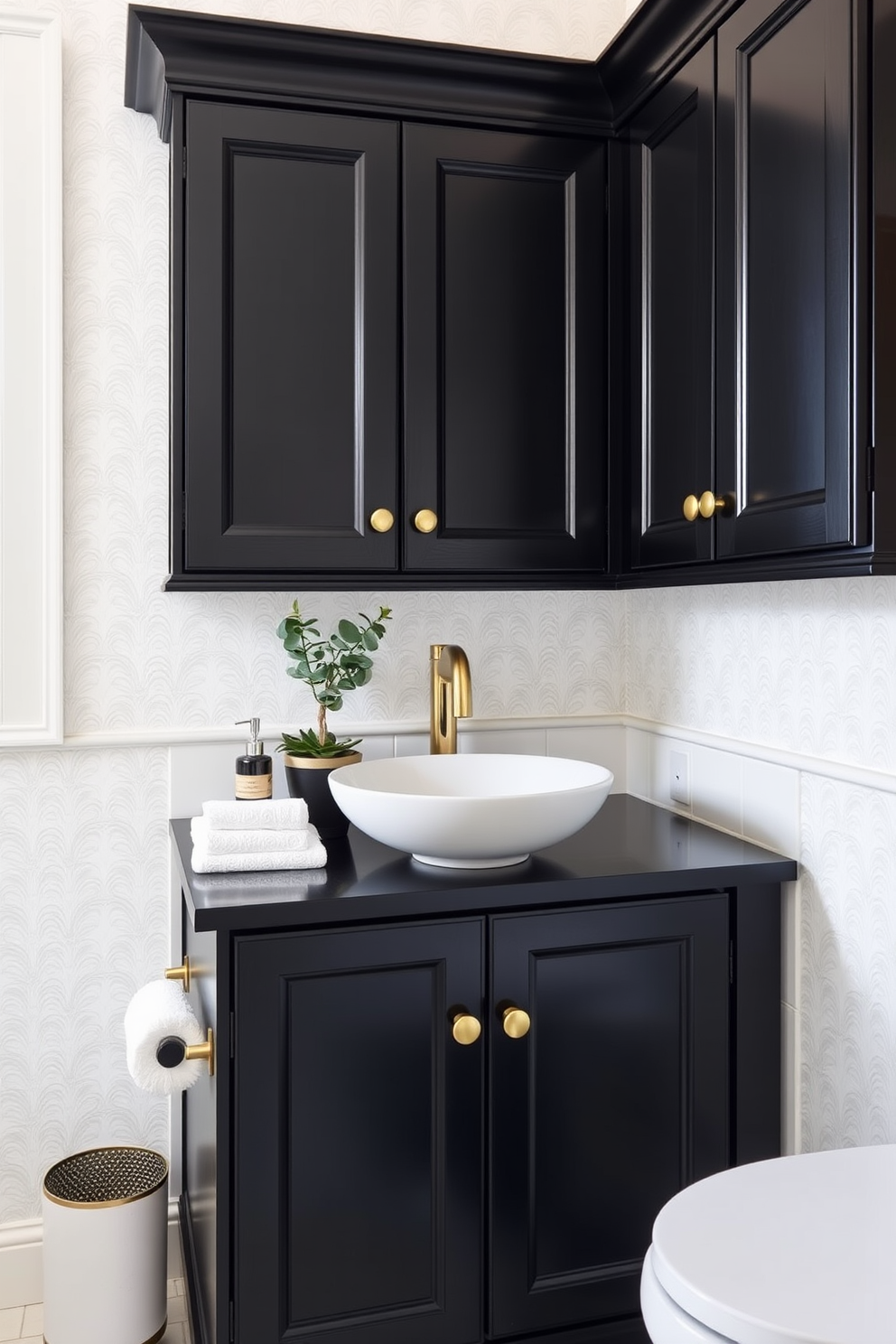 A sleek black powder room features bold black walls that create a dramatic backdrop. The space is accented with brass hardware on the cabinetry and fixtures, adding a touch of elegance and contrast. A minimalist black vanity with a brass faucet sits against the wall, complemented by a round brass mirror above. The floor is adorned with geometric black and white tiles, enhancing the modern aesthetic of the room.