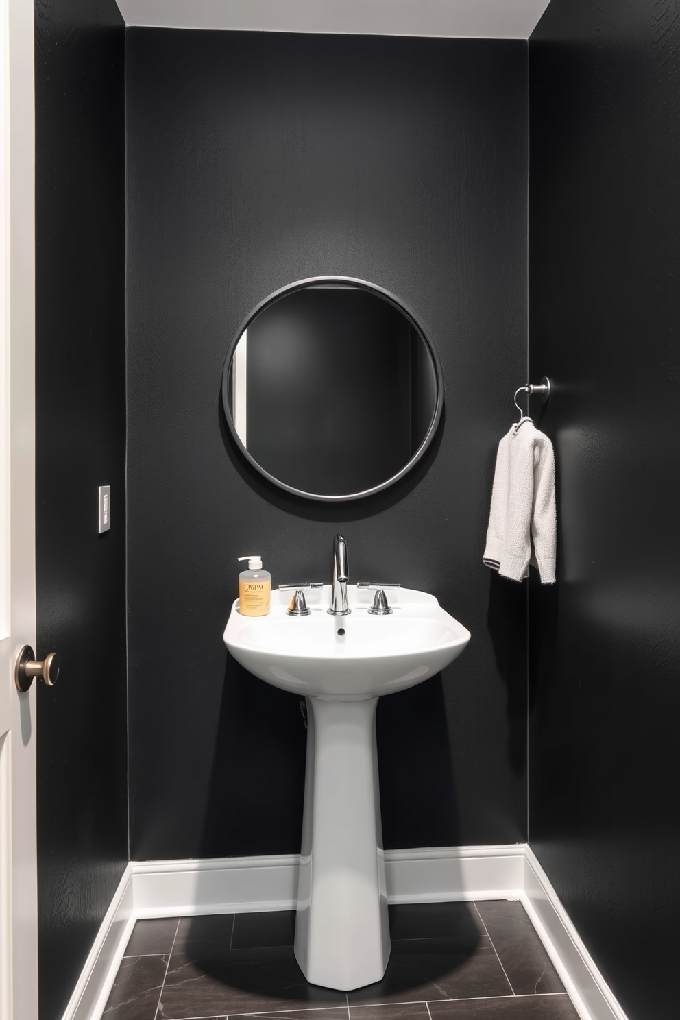 A sleek powder room featuring textured black paint that adds depth and interest to the space. The room includes a stylish pedestal sink with a polished chrome faucet and a round mirror framed in matte black.