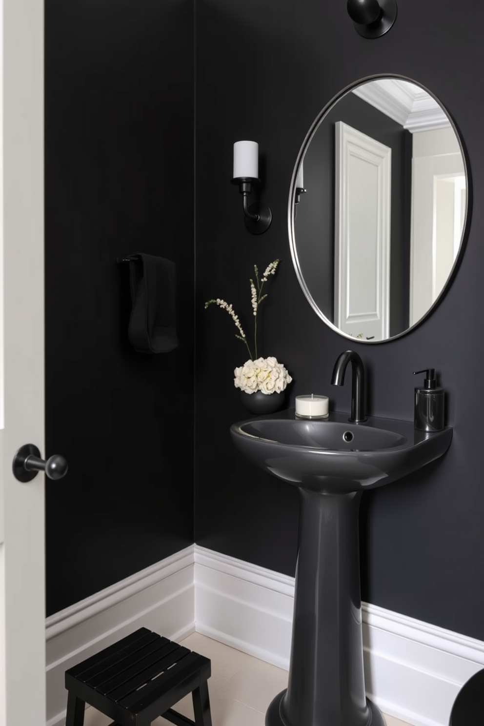 A bold black powder room featuring art deco elements. The walls are adorned with geometric black and gold wallpaper, and a sleek black pedestal sink stands prominently in the center. Elegant lighting fixtures with intricate designs illuminate the space. A large, round mirror with a black and gold frame reflects the striking decor, enhancing the luxurious ambiance.