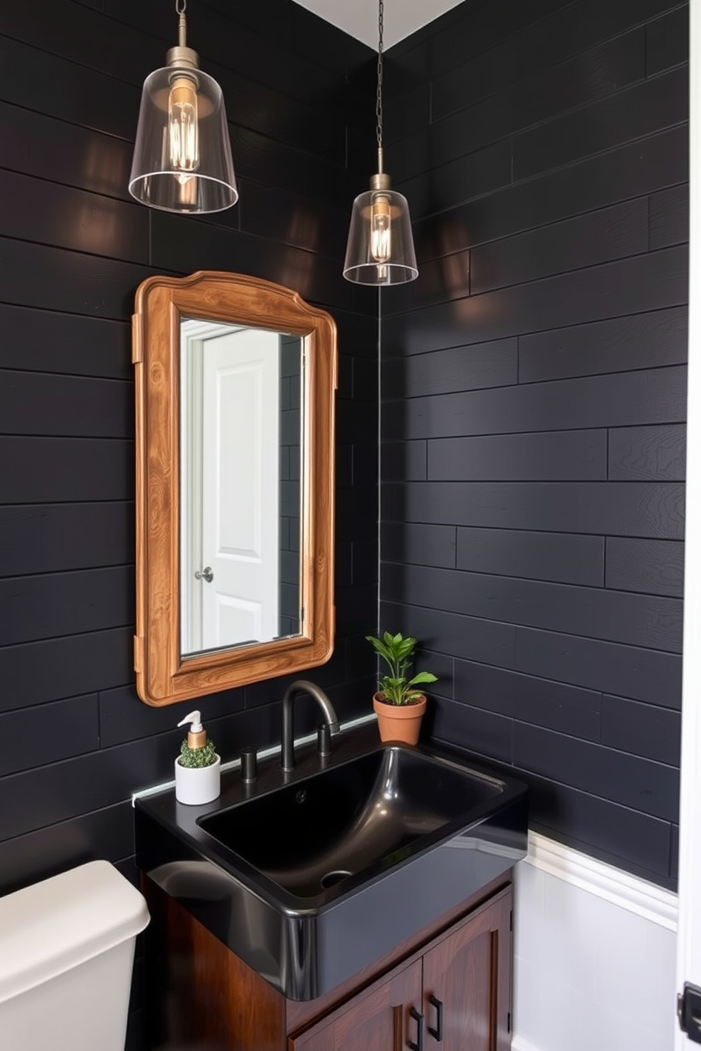 A cozy powder room featuring black shiplap walls that exude rustic charm. The space is accented with a vintage wooden mirror and a sleek black sink that complements the dark wall treatment. Soft lighting fixtures hang from the ceiling, creating a warm ambiance. A small potted plant sits on the countertop, adding a touch of greenery to the elegant design.