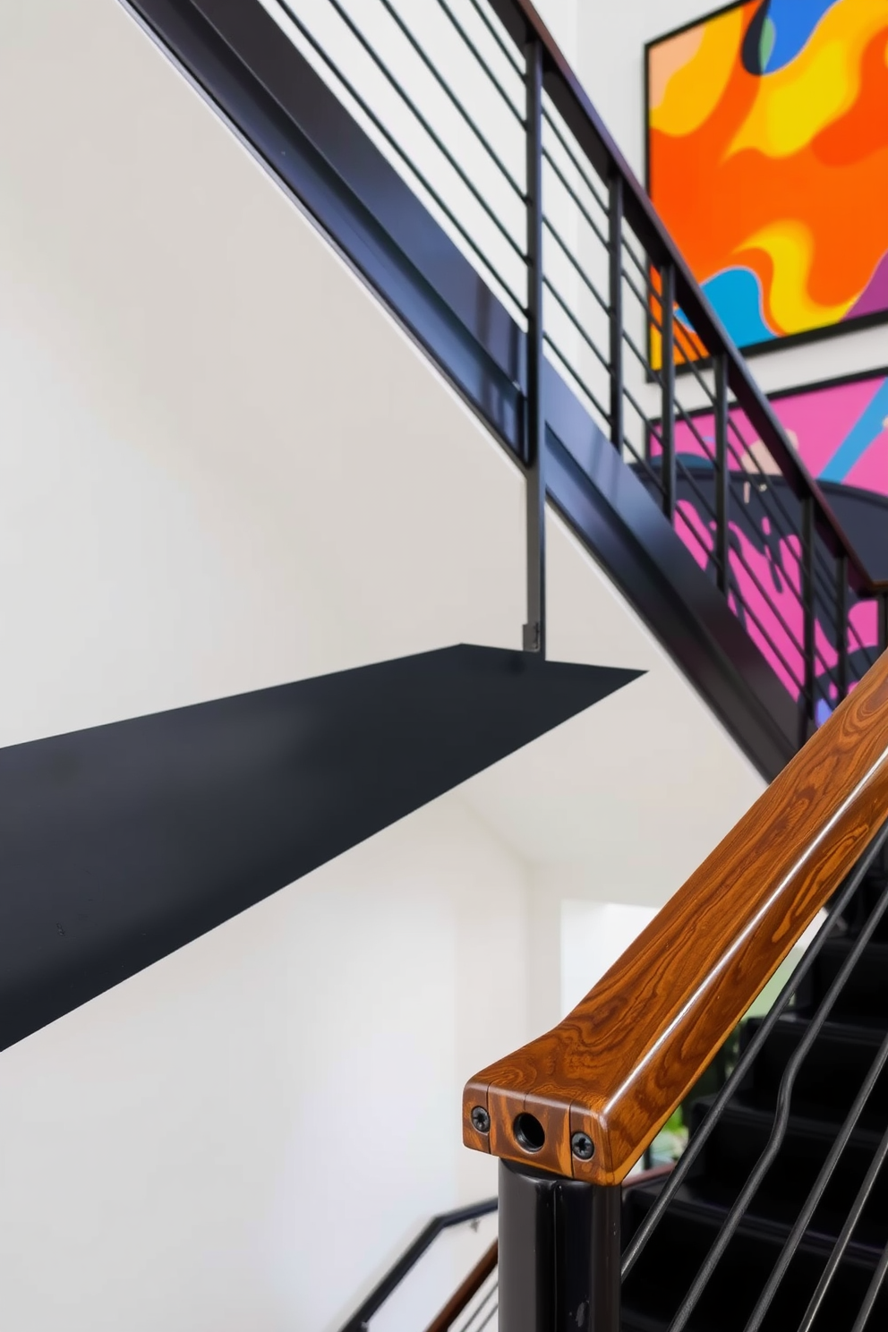 A stylish black staircase features sleek, modern railings and a polished wooden handrail. The walls are adorned with vibrant, colorful wall art that adds a playful contrast to the sophisticated staircase design.