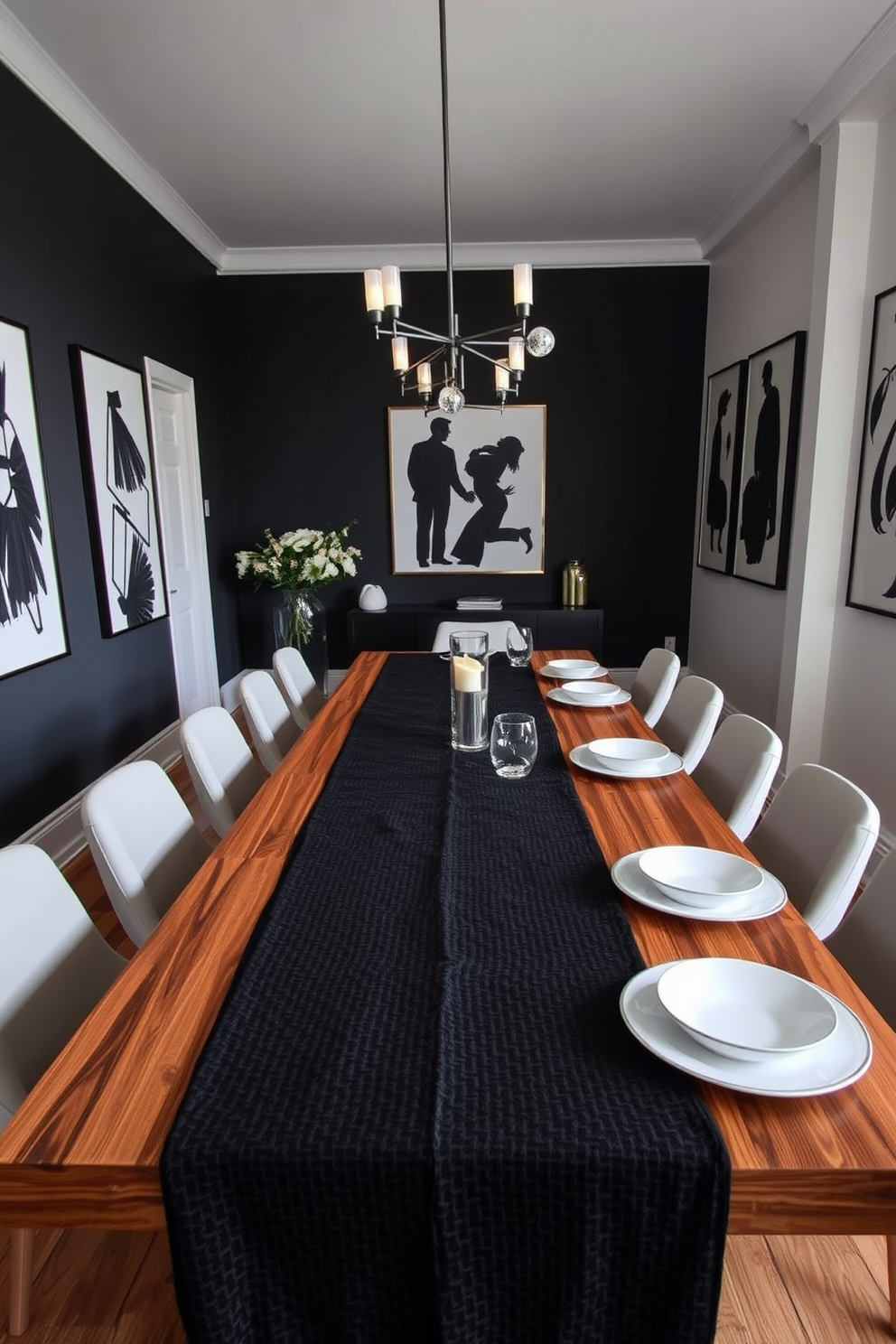 A stylish dining room featuring a textured black tablecloth draped elegantly over a long wooden table. The table is set with white dishes, creating a striking contrast that enhances the sophisticated atmosphere of the space. The walls are adorned with black and white artwork, complementing the monochromatic theme. A modern chandelier hangs above the table, casting a warm glow over the elegant setting.