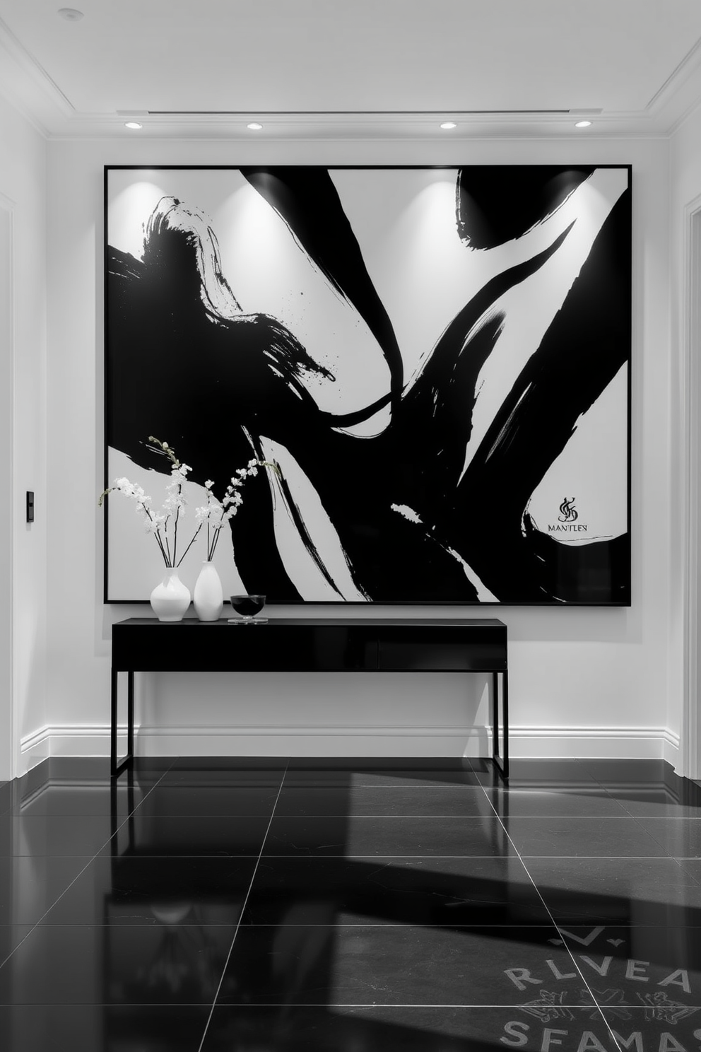 A striking foyer features a large contemporary black and white artwork display that serves as the focal point of the space. The walls are painted in a crisp white, allowing the bold artwork to stand out and create an inviting atmosphere. The flooring is a sleek black tile that complements the artwork while adding a touch of elegance. A minimalist console table in black sits against the wall, adorned with a few carefully selected decorative items in monochrome tones.