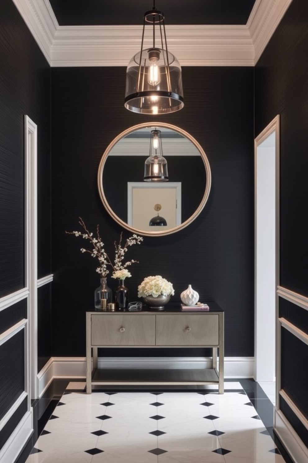 A luxurious white chandelier hangs elegantly from the high ceiling of the foyer. The space features a striking black and white color palette with bold geometric patterns on the floor. The walls are adorned with sleek black paneling that contrasts beautifully with the white accents. A stylish console table sits against one wall, topped with decorative objects that enhance the modern aesthetic.