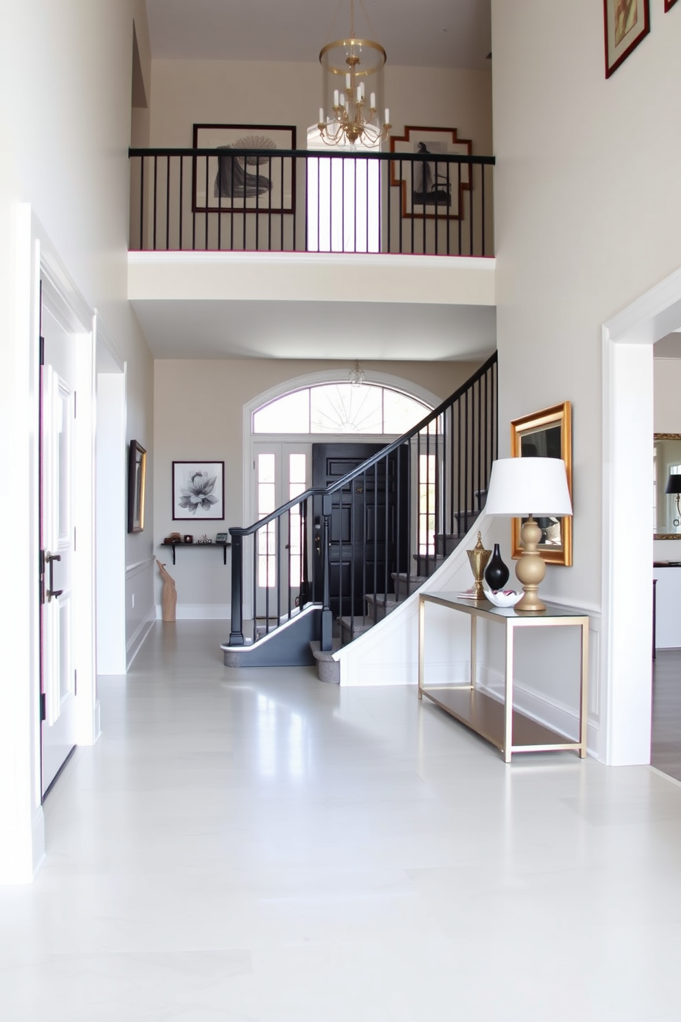 Open foyer with a grand entrance featuring a black and white stair railing that adds elegance to the space. The walls are adorned with framed art pieces, and a sleek console table sits against one side, topped with decorative accents.