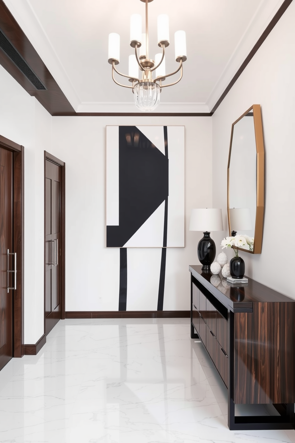 A striking foyer featuring bold black and white geometric wall art that serves as a focal point. The space is illuminated by a modern chandelier, complementing the sleek lines of the decor. The flooring is a polished white marble that contrasts beautifully with dark wood accents throughout the area. A stylish console table with a minimalist design sits against the wall, adorned with a few carefully chosen decorative items.