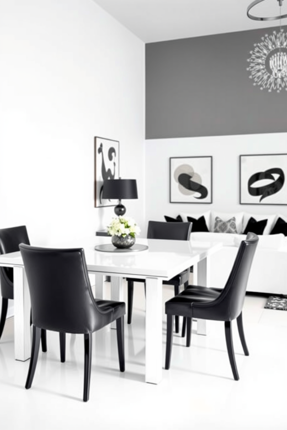 Elegant black dining chairs surround a sleek white table, creating a striking contrast that exudes sophistication. The table is adorned with a tasteful centerpiece, and soft lighting enhances the inviting atmosphere of the dining area. The living room features a harmonious blend of black and white elements, with a plush white sofa and bold black accent pillows. Artistic black and white wall decor complements the modern furnishings, creating a chic and stylish space.