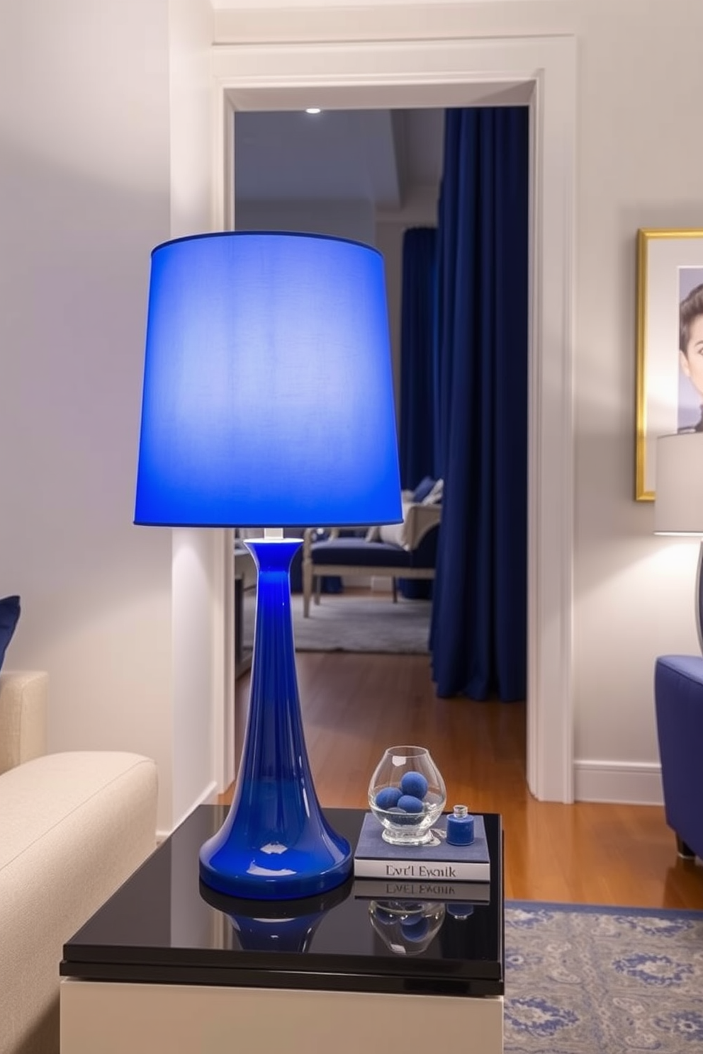 A royal blue ottoman adds a chic touch to the living space. The apartment features a modern design with sleek lines and a vibrant color palette.