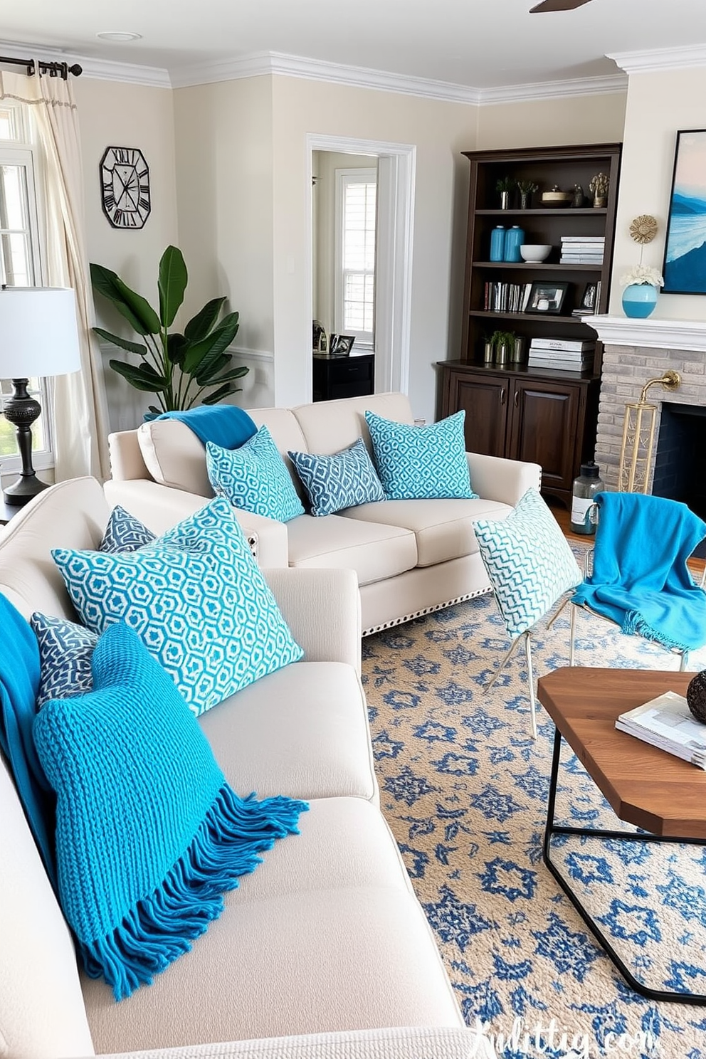 A cozy living room featuring sofas adorned with cerulean throw blankets. The space is designed with a modern aesthetic, showcasing blue tones throughout the decor.