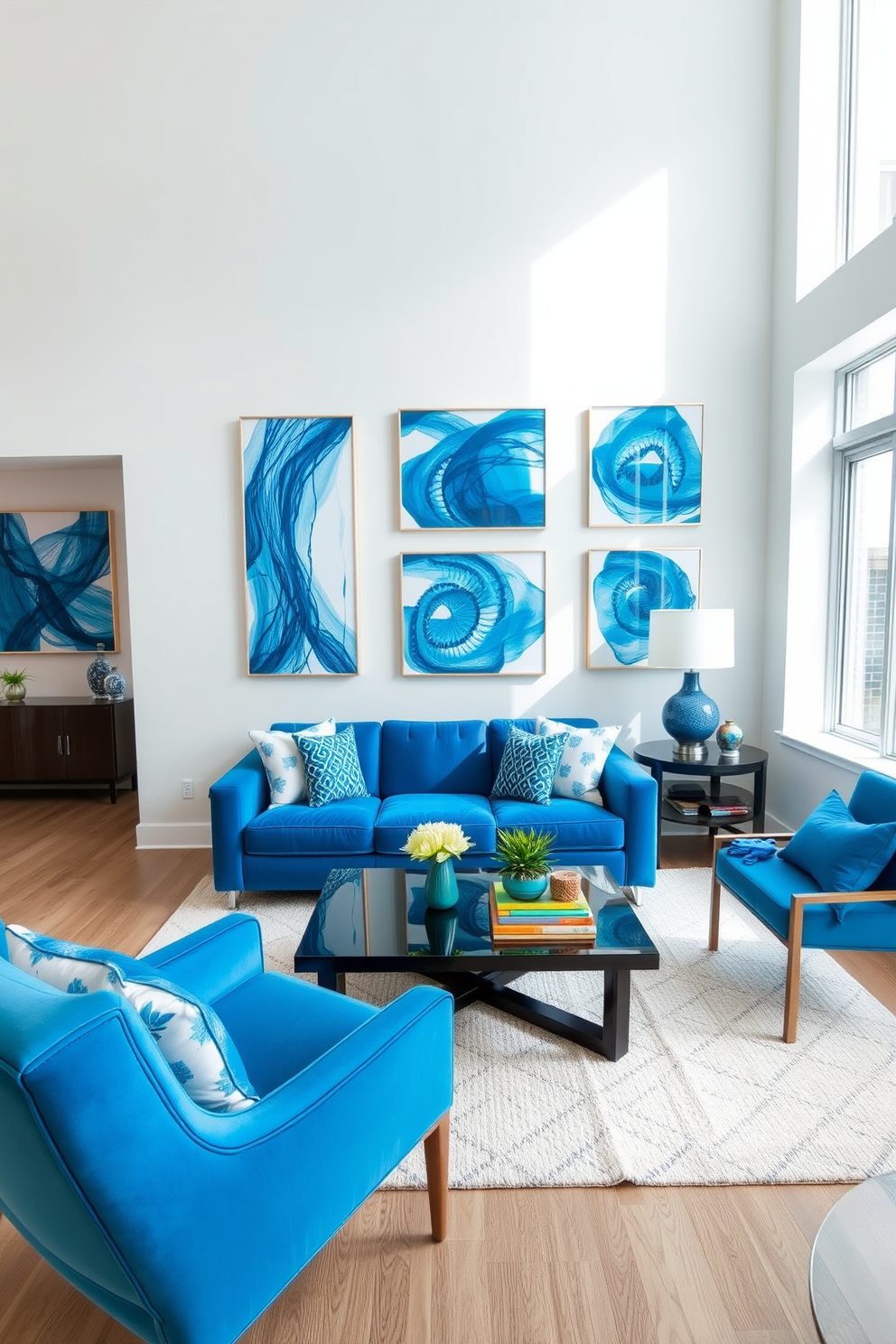 A bright and airy apartment featuring walls adorned with vibrant blue artwork that complements the modern decor. The space includes a cozy seating area with a plush blue sofa, accented by decorative pillows in varying shades of blue and white. Large windows allow natural light to flood in, creating an inviting atmosphere. A sleek coffee table sits in front of the sofa, surrounded by stylish accent chairs that enhance the overall blue theme of the design.