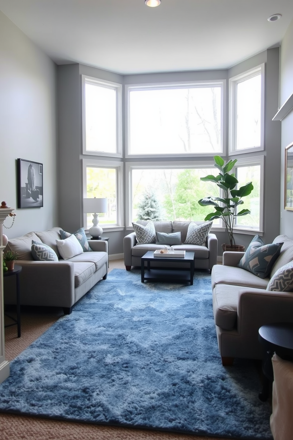 A cozy basement retreat featuring a soft blue area rug that adds warmth and comfort to the space. The walls are painted in a light gray hue, and large windows allow natural light to flood in, enhancing the inviting atmosphere.