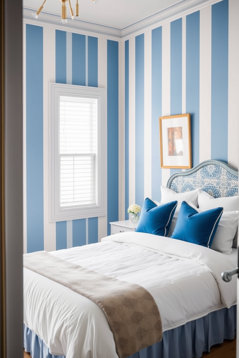 A serene bedroom featuring denim blue wallpaper adorned with delicate floral accents. The room is complemented by a plush white bedspread and a mix of decorative pillows in soft pastels. Natural light filters through sheer curtains, enhancing the tranquil atmosphere. A vintage wooden dresser sits against one wall, adorned with a small potted plant and framed artwork.