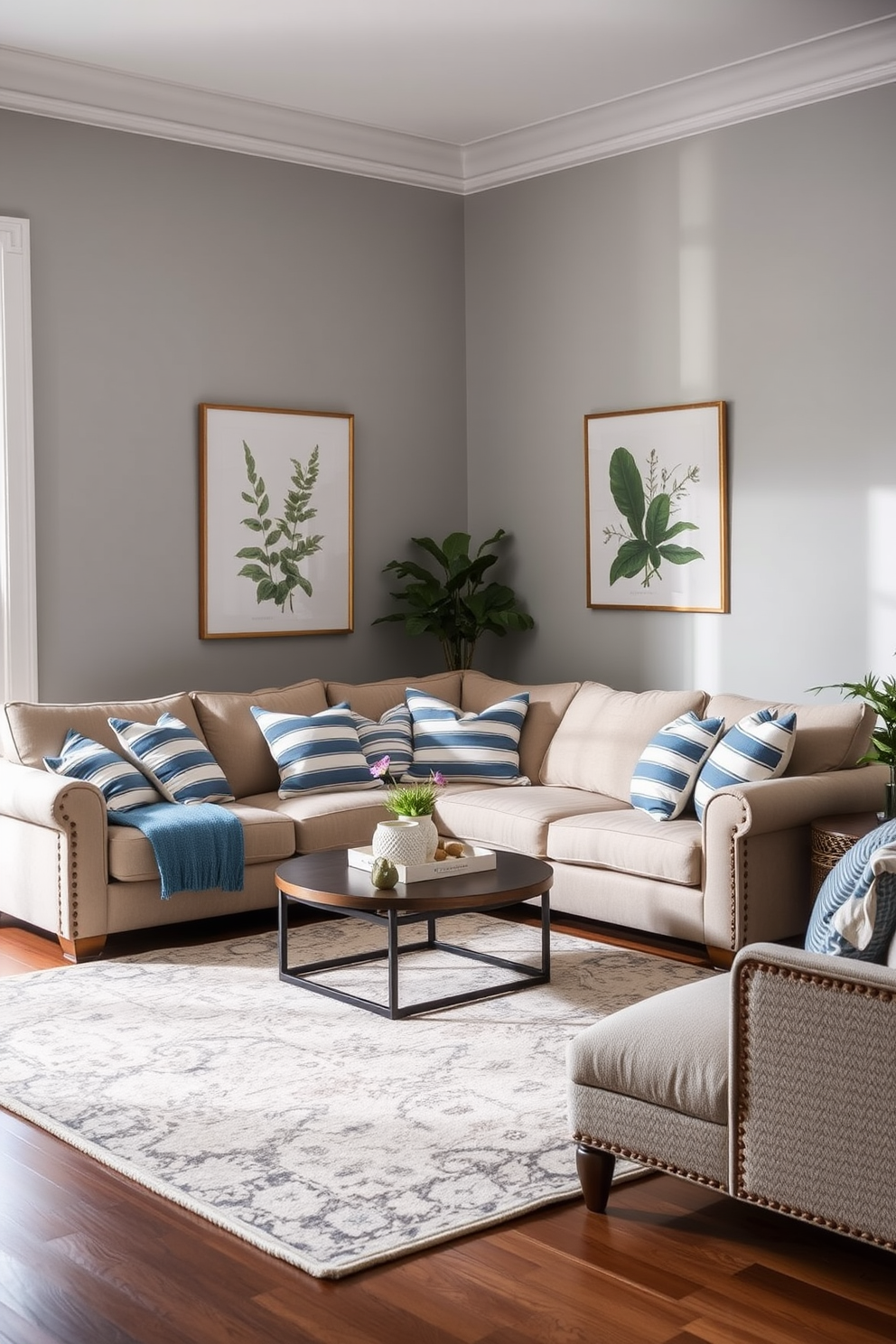 A cozy family room featuring blue and white striped throw pillows scattered across a plush sectional sofa. The walls are painted in a soft gray, and a large area rug in neutral tones anchors the space.