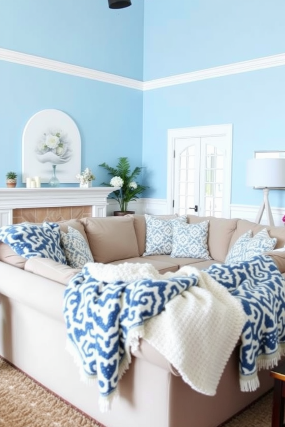 A serene family room featuring sky blue walls adorned with white accents. Cozy throw blankets with a blue and white pattern are draped over a plush sectional sofa, inviting relaxation and comfort.