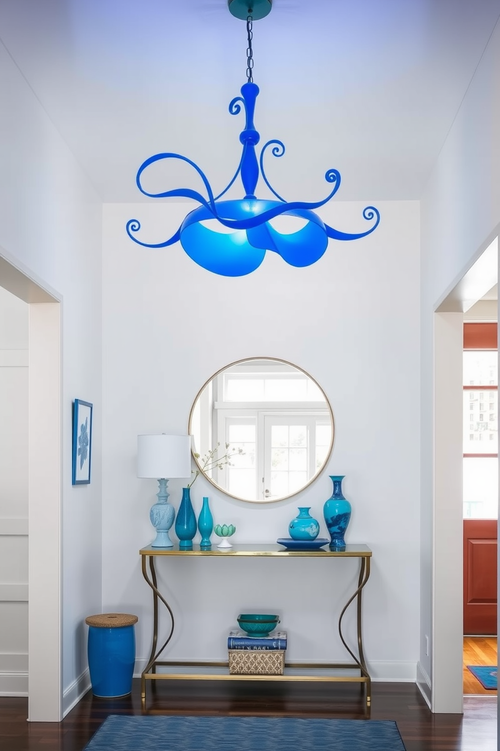 A whimsical blue ceiling light fixture hangs gracefully in the foyer, casting a soft glow that enhances the playful atmosphere. The walls are painted in a crisp white, providing a striking contrast to the vibrant blue accents throughout the space. The foyer features a stylish console table adorned with decorative objects in varying shades of blue. A large round mirror above the table reflects the light, creating an inviting and spacious feel.