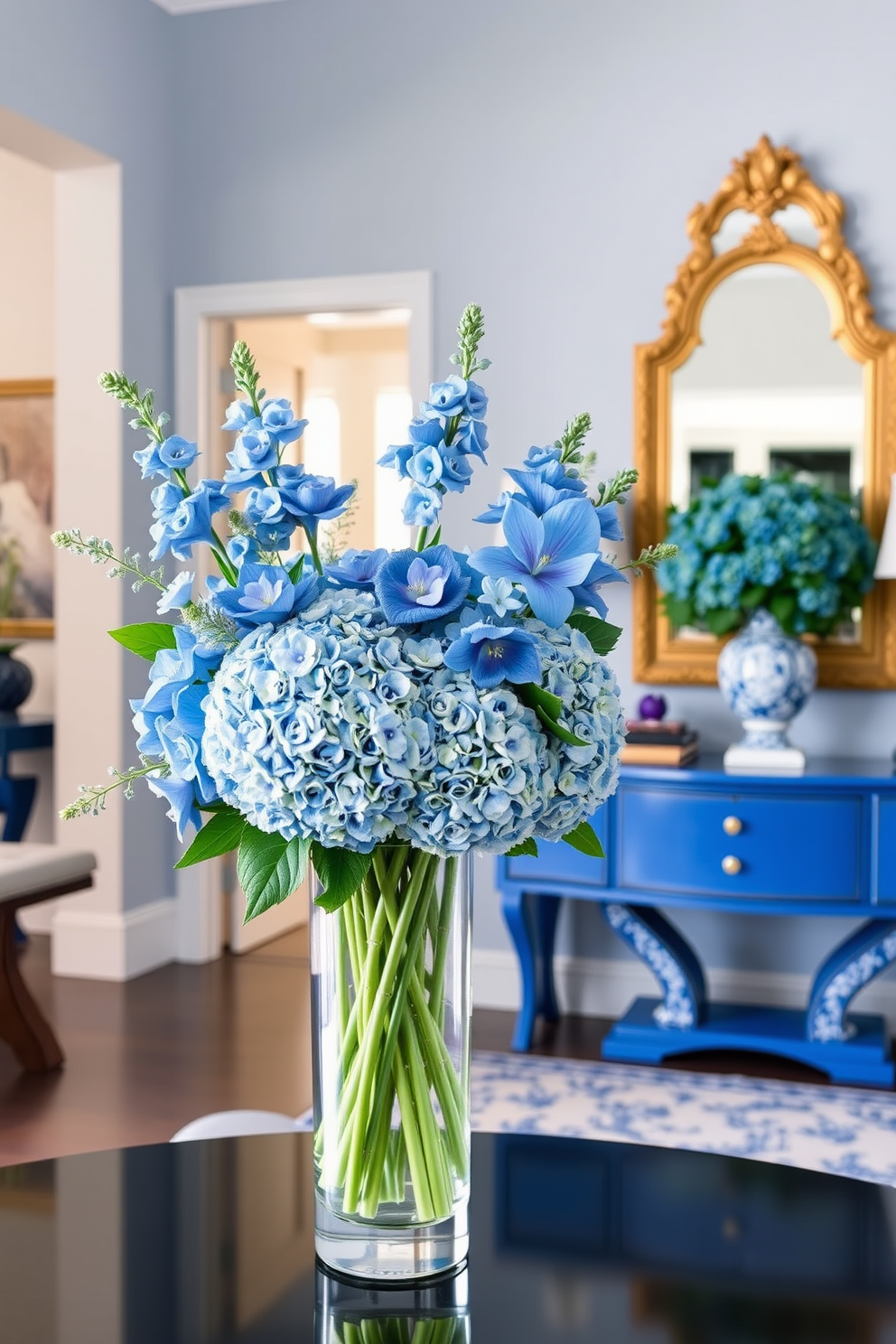 Elegant blue floral arrangements for freshness. The arrangements feature a variety of blue flowers, including hydrangeas and delphiniums, artfully arranged in a sleek glass vase. Blue foyer design ideas. The foyer is adorned with a statement blue console table, complemented by a large mirror with a gold frame and decorative blue accents throughout the space.