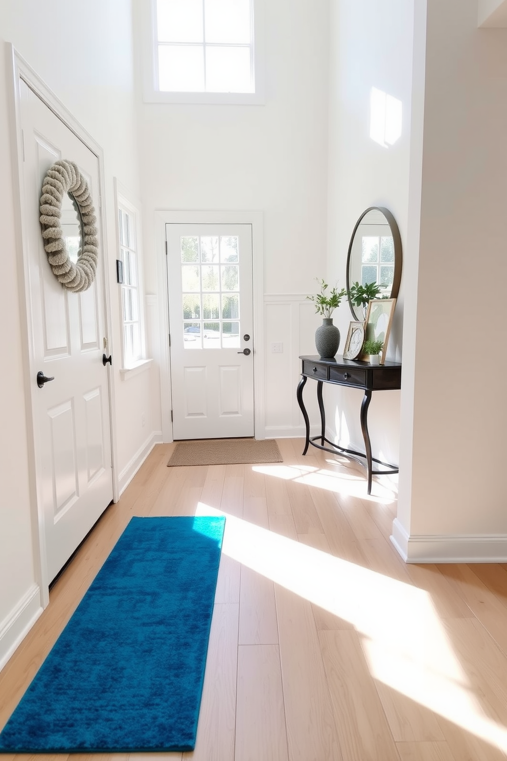 A stunning foyer featuring a soft duck egg blue color palette. The walls are adorned with elegant art pieces in varying shades of blue, creating a serene and inviting atmosphere. The flooring is a light wood that complements the blue accents beautifully. A stylish console table with decorative items sits against the wall, enhancing the overall elegance of the space.