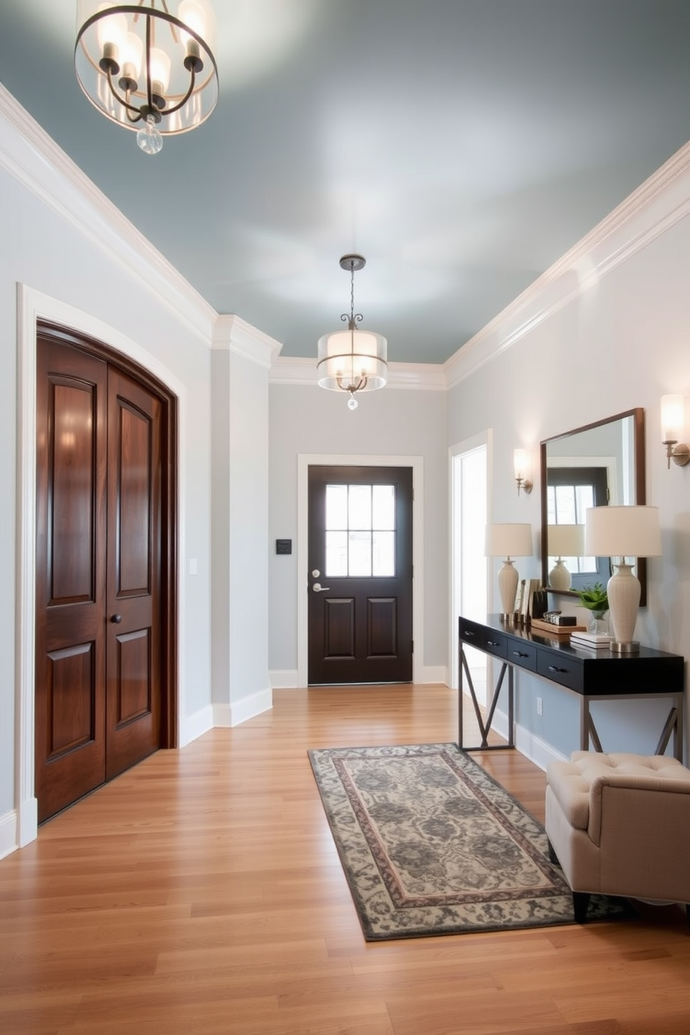 A sky blue painted ceiling adds depth and a serene ambiance to the foyer. The foyer features elegant lighting fixtures that complement the soft hues of the walls. The flooring is a mix of light hardwood and a stylish area rug to create warmth. A sleek console table stands against one wall, adorned with decorative objects and a mirror above it to enhance the space.