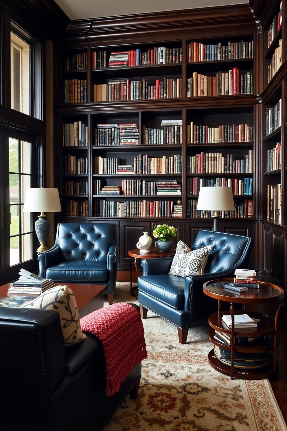 A cozy home library featuring navy blue leather chairs that exude sophistication. The walls are lined with dark wood bookshelves filled with an array of books, and a plush area rug anchors the seating area.