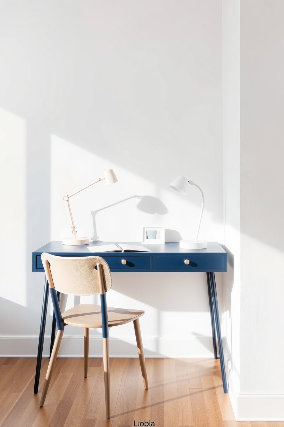 A navy blue desk is positioned against a soft white wall, complemented by light decor elements that create a serene workspace. A stylish desk lamp and a few minimalist accessories enhance the overall aesthetic, while a comfortable chair invites productivity.