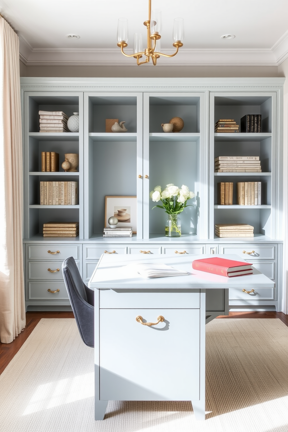 A serene home office featuring a robins egg blue desk adorned with elegant brass hardware. The room is filled with natural light, highlighting the soft textures and calming color palette.