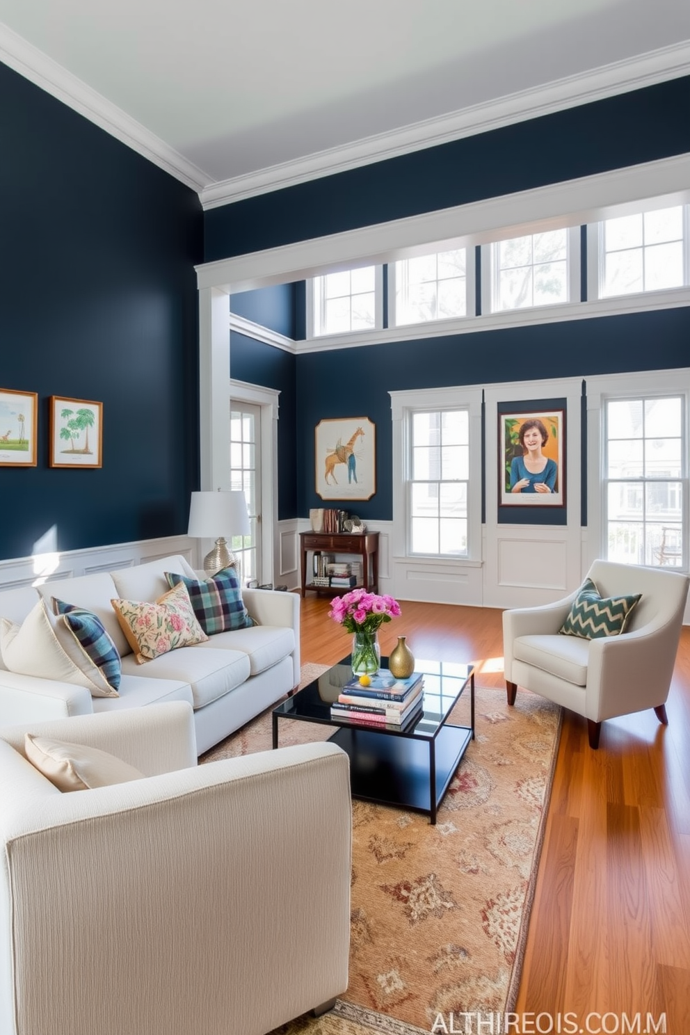 A cozy living room featuring navy blue walls accented with crisp white trim. The space is furnished with a plush white sofa adorned with colorful throw pillows and a sleek glass coffee table at the center. In one corner, a stylish armchair complements the decor, while a large area rug adds warmth to the hardwood floor. Floor-to-ceiling windows allow natural light to flood the room, enhancing the inviting atmosphere.