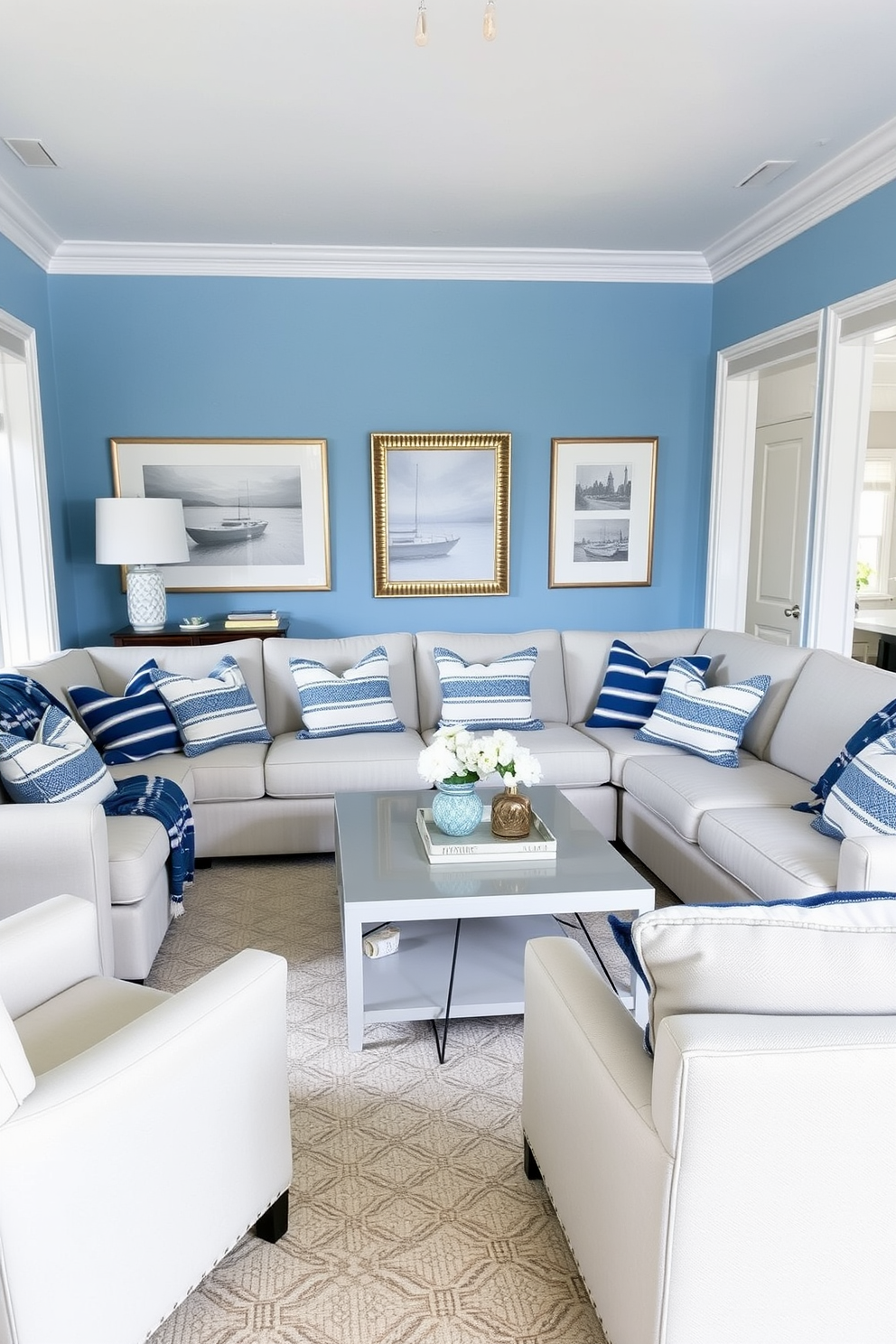 A cozy blue living room featuring a large sectional sofa adorned with blue and white striped throw blankets. The walls are painted in a soft light blue hue, complemented by white trim and a stylish coffee table in the center.