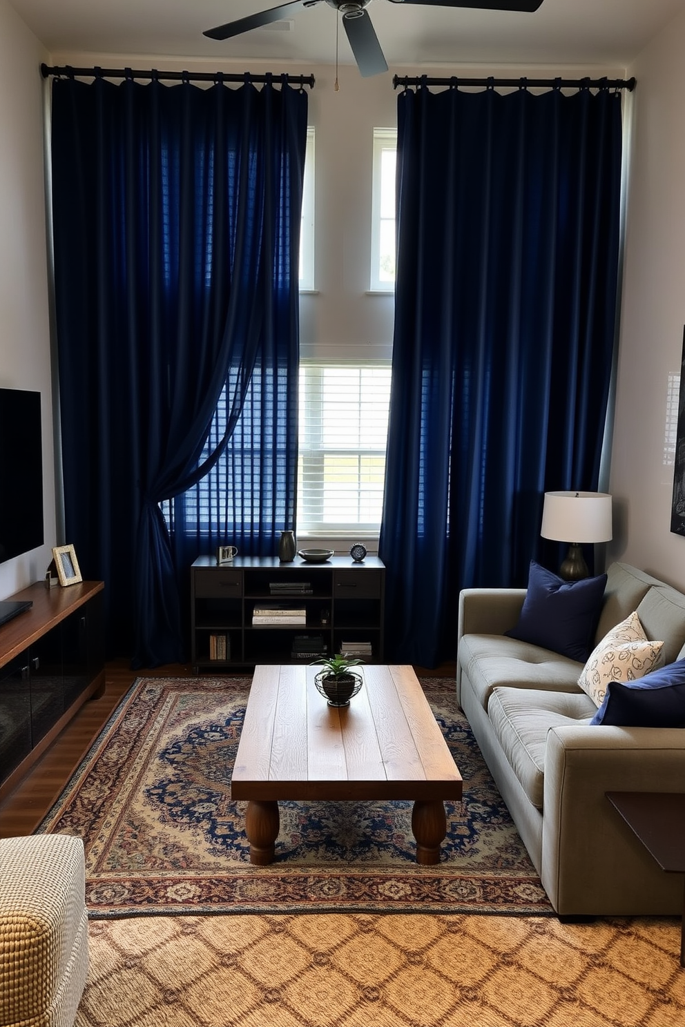 A cozy living room featuring neutral sofas adorned with blue accent pillows that add a pop of color. The space is enhanced by warm lighting and a plush area rug that ties the room together. A stylish man cave designed with a mix of comfort and sophistication. Leather seating options are complemented by dark wood accents and sports memorabilia, creating a perfect retreat for relaxation and entertainment.