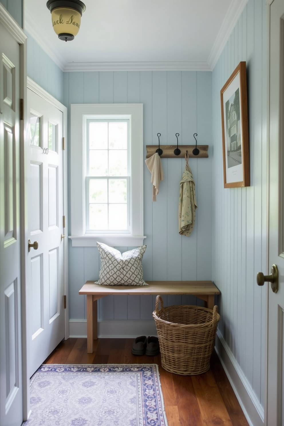 A stylish mudroom features dark blue cabinetry with sleek white countertops. The space is accented with practical storage solutions and decorative elements that enhance functionality and aesthetics.