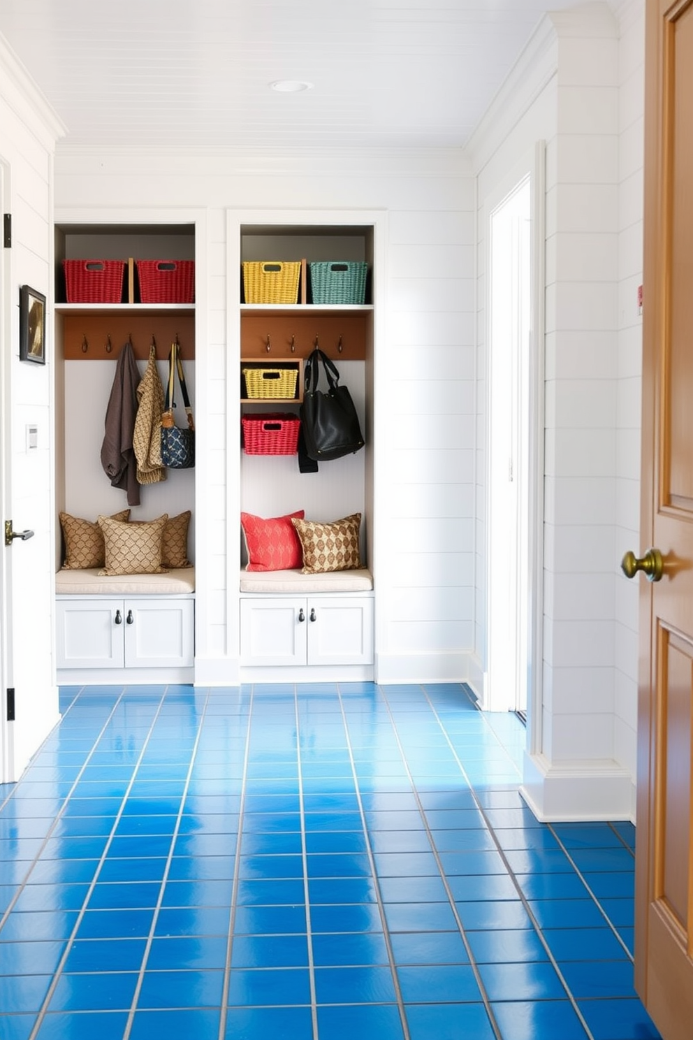 A tranquil mudroom featuring dusty blue walls that evoke a sense of calm and serenity. The space includes built-in storage benches with soft cushions and a variety of hooks for hanging coats and bags. Natural light floods in through a large window, illuminating a stylish area rug that complements the blue tones. Potted plants add a touch of greenery, enhancing the inviting atmosphere of the room.