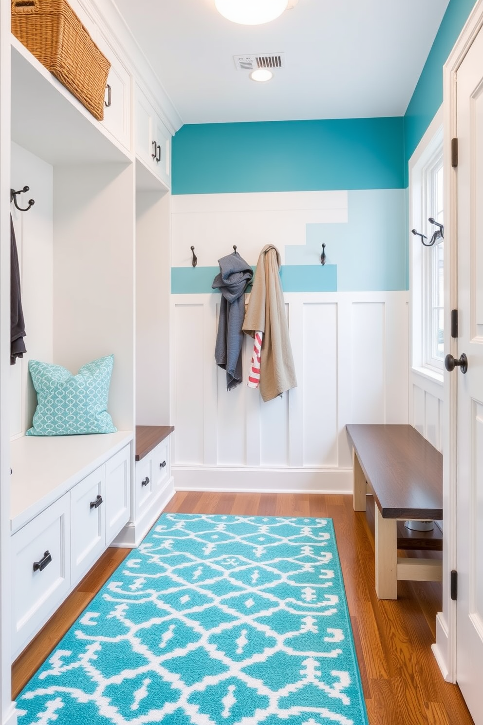 A denim blue mudroom featuring rustic decor. The space includes a wooden bench with storage underneath and hooks on the wall for hanging coats and bags. Natural light pours in through a large window, illuminating the distressed wood flooring. A woven basket sits beside the bench, adding a touch of warmth and texture to the room.