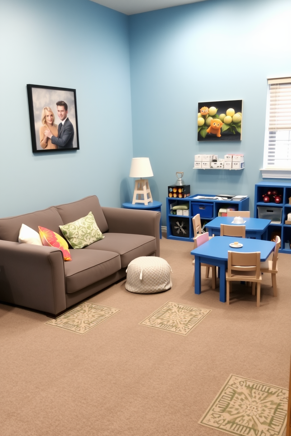 A serene playroom featuring a blue and gray color palette that promotes calmness and creativity. The walls are painted in a soft blue, while the flooring is a cozy gray carpet that cushions little feet. In one corner, there is a large, plush gray sofa adorned with colorful throw pillows. Nearby, a low blue table is surrounded by child-sized chairs, perfect for arts and crafts activities.