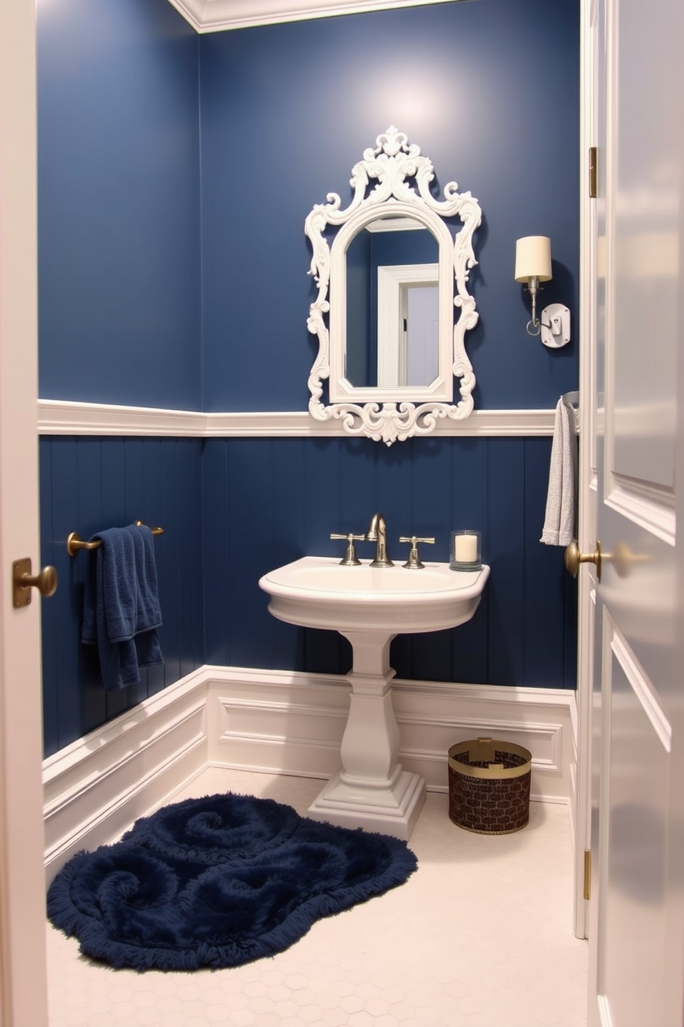 A classic blue and white powder room features elegant wainscoting painted in crisp white, complemented by a deep blue accent wall. The space includes a vintage-style pedestal sink with a polished chrome faucet and an ornate mirror framed in white, reflecting the room's timeless charm. The flooring consists of white hexagonal tiles that add texture, while a plush blue area rug anchors the space. Decorative elements such as a small potted plant and scented candles enhance the inviting atmosphere, making it a perfect retreat.