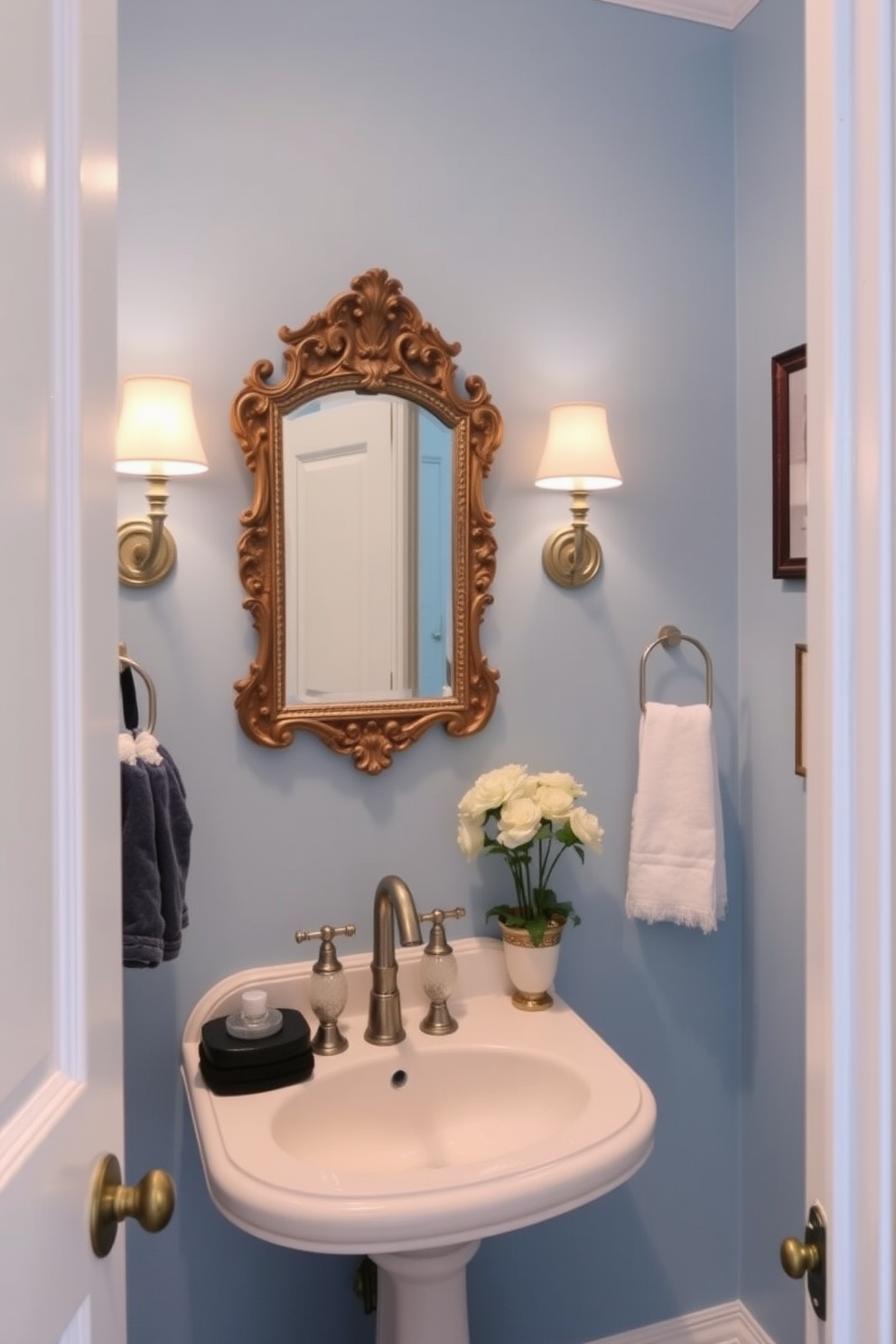 A charming powder room featuring soft blue paint on the walls that creates a serene atmosphere. Vintage decor elements such as an ornate mirror and a classic pedestal sink add character and elegance to the space.