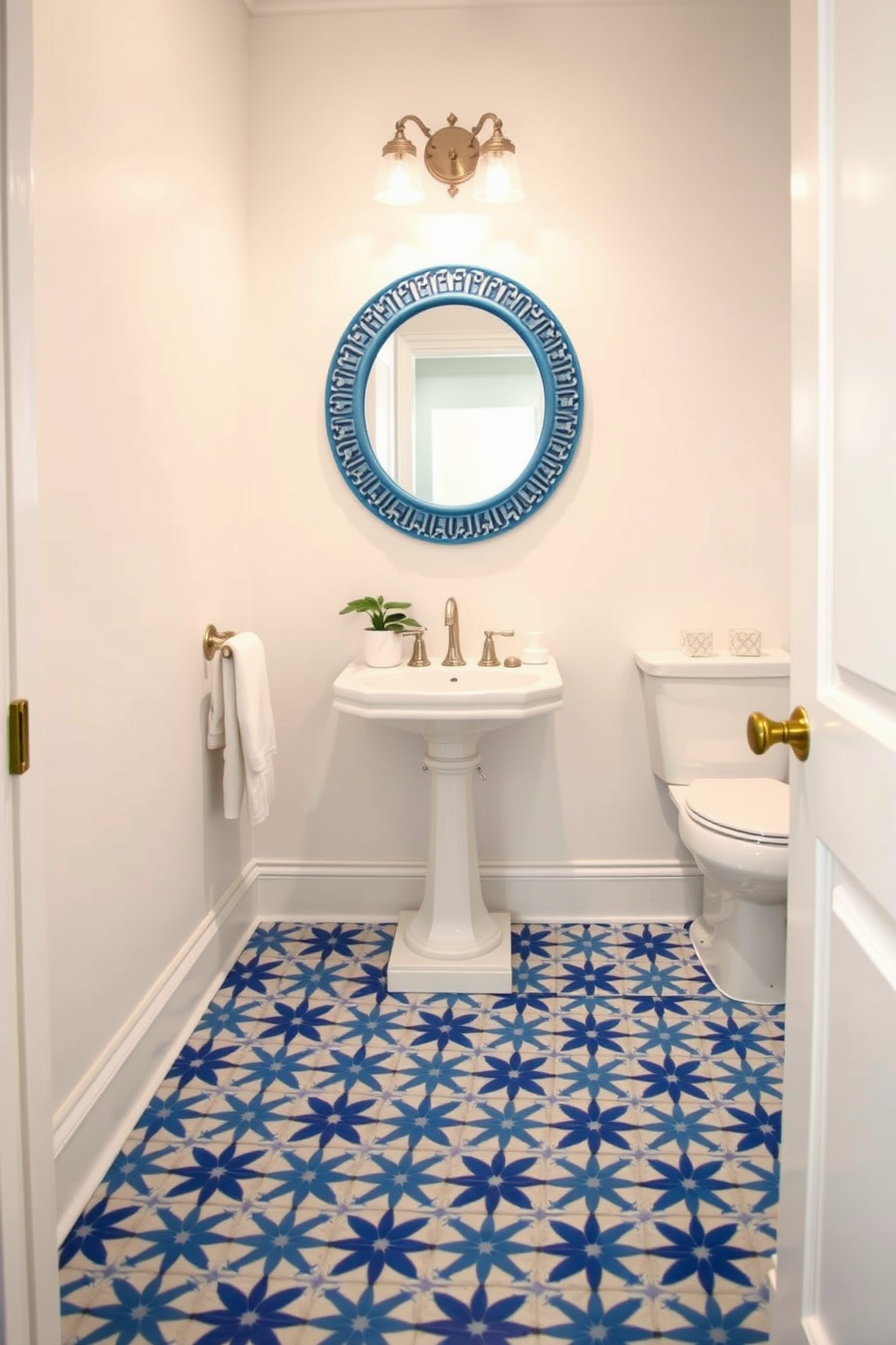 A chic powder room featuring blue and white patterned floor tiles that create a vibrant yet calming atmosphere. The walls are painted a soft white, complementing the intricate tile design and enhancing the room's spacious feel. A stylish pedestal sink with a sleek chrome faucet sits against one wall, while a round mirror with a decorative blue frame hangs above it. To add a touch of elegance, a small potted plant is placed on the countertop, bringing a hint of greenery to the space.