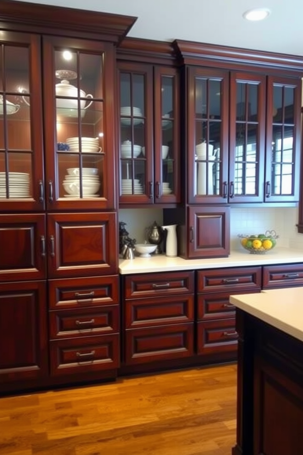 A warm and inviting kitchen featuring deep mahogany cabinets with elegant glass doors that showcase tasteful dishware. The countertops are a rich cream color, complementing the dark wood and enhancing the overall sophistication of the space.