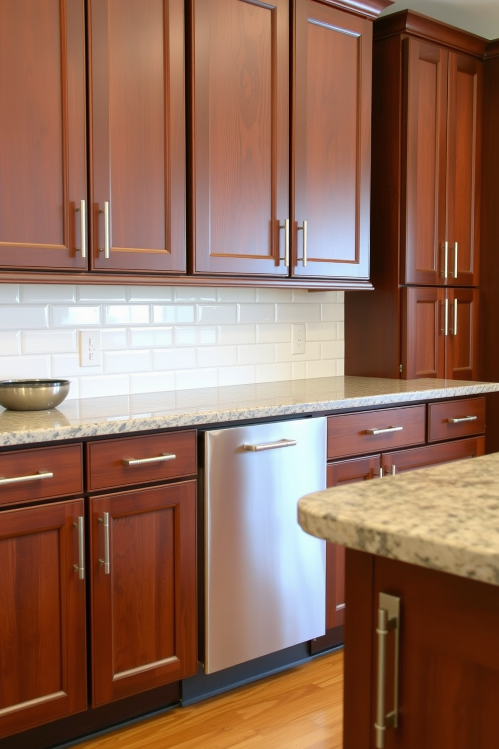 A warm and inviting kitchen setting features brown shaker cabinets with stainless steel hardware providing a sleek contrast. The countertops are a light granite, and the backsplash showcases a subtle white subway tile pattern, enhancing the overall design.