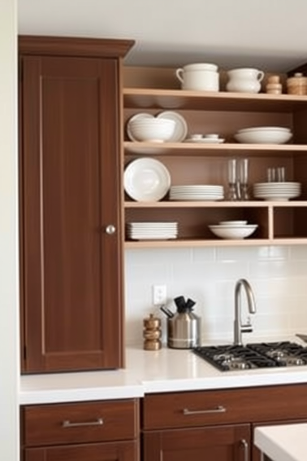 A modern kitchen featuring two-tone brown cabinets with a rich dark brown on the lower cabinets and a lighter beige tone on the upper cabinets. Open shelving above the countertop displays stylish dishware and decorative items, creating an inviting and functional space.