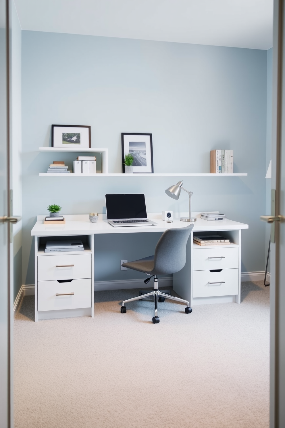 A modern budget-friendly study room featuring a sleek desk with built-in storage solutions. The walls are painted in a calming light blue, and the floor is covered with a soft gray carpet.